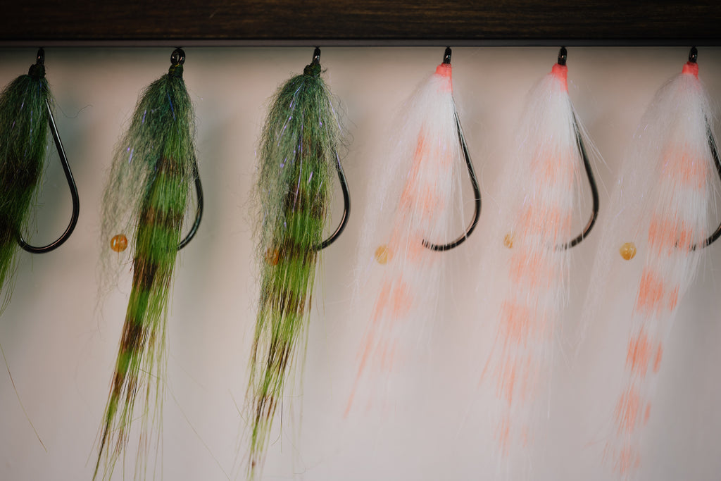 a group shot of several Bendback Shrimp redfish flies tied by Josh Idol of Two Aught Fly Fishing Co