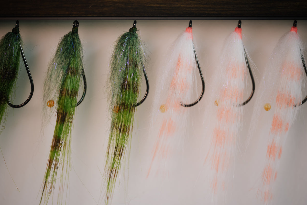 a group shot of several Bendback Shrimp redfish flies tied by Josh Idol of Two Aught Fly Fishing Co