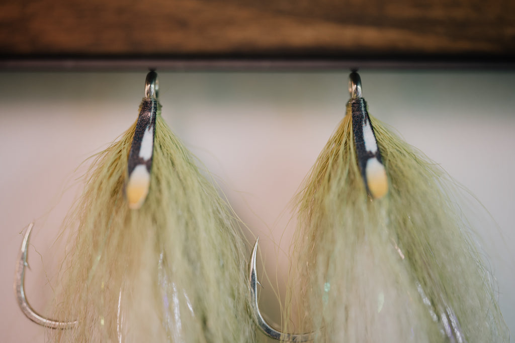 a group photo of several Beach Mullet tarpon flies by Two Aught Fly Fishing Co