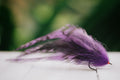 the Dredge Fleye tarpon fly in purple colorway tied by Josh Idol of Two Aught Fly Fishing Co