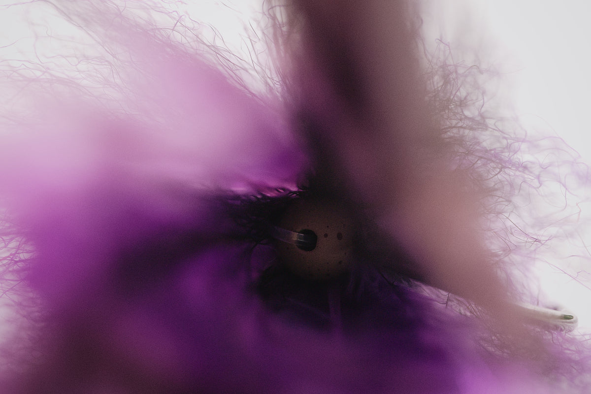 details of the Dredge Fleye tarpon fly in purple colorway tied by Josh Idol of Two Aught Fly Fishing Co