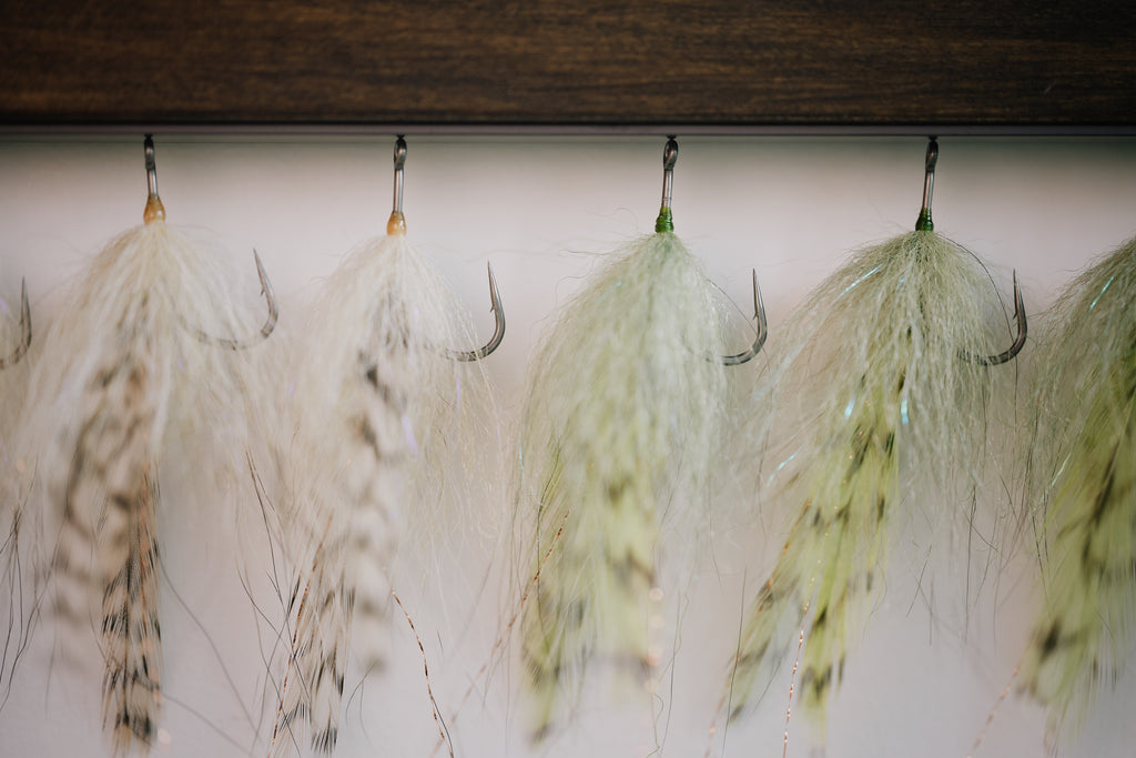 a group of Foxy Bug tarpon flies tied by Josh Idol of Two Aught Fly Fishing Co