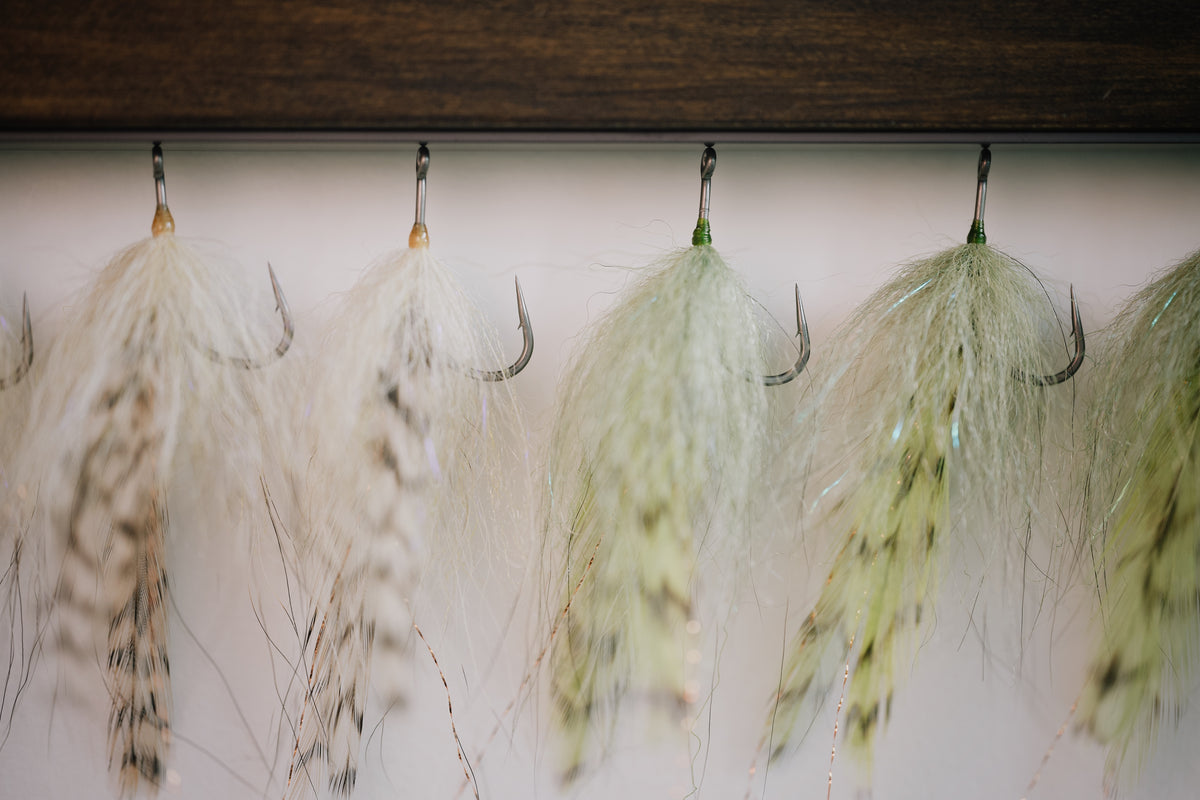 a group of Foxy Bug tarpon flies tied by Josh Idol of Two Aught Fly Fishing Co