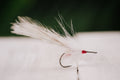 the Glades Deceiver snook fly in white colorway tied by Josh Idol of Two Aught Fly Fishing Co