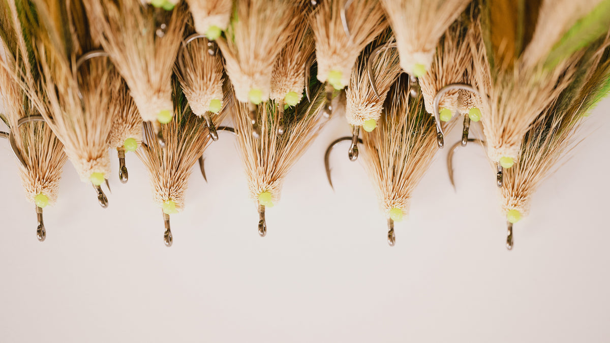 a closeup photo of a group of Mouse tarpon flies from Two Aught Fly Fishing Co