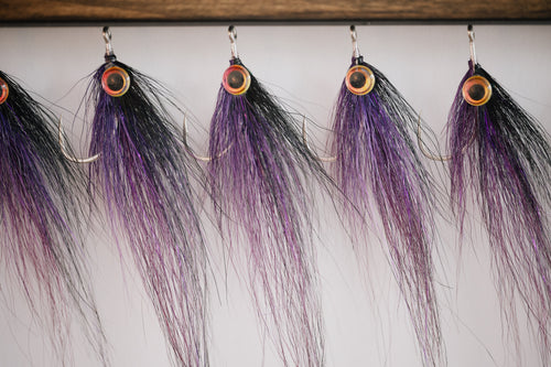 Peanut Butter tarpon flies hanging from my drying rack waiting to be shipped