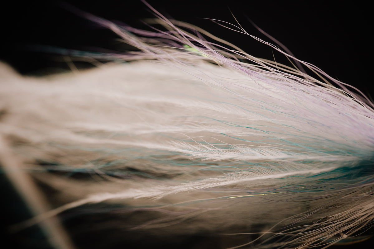a macro view of the hollow ostrich ties and mixed flash in the body of the Pinfish fly by Two Aught Fly Fishing Co
