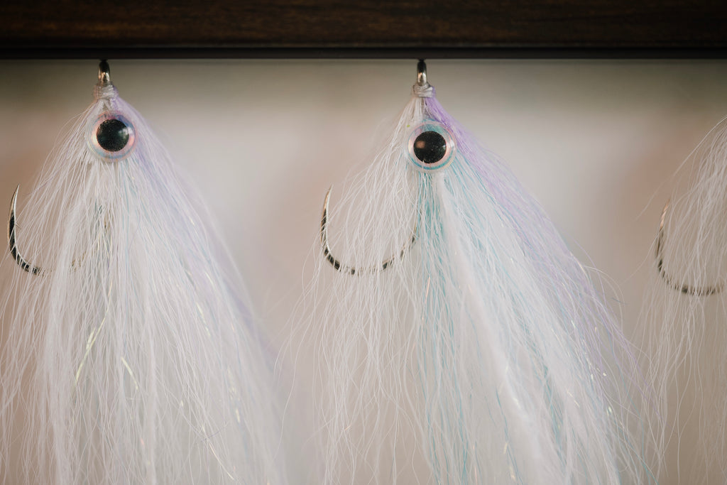 a closeup photo of a group of Pinfish flies tied by Josh Idol at Two Aught Fly Fishing Co