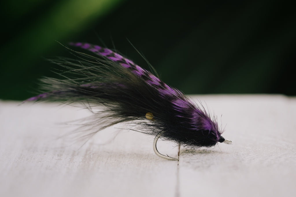 a photo of the Shrimp tarpon fly in black colorway tied by Josh Idol of Two Aught Fly Fishing Co
