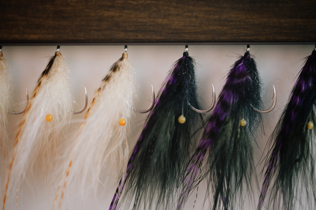 a group of the Shrimp tarpon flies tied by Josh Idol of Two Aught Fly Fishing Co