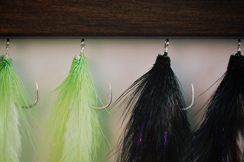 a group of the Snake tarpon flies tied by Josh Idol of Two Aught Fly Fishing Co