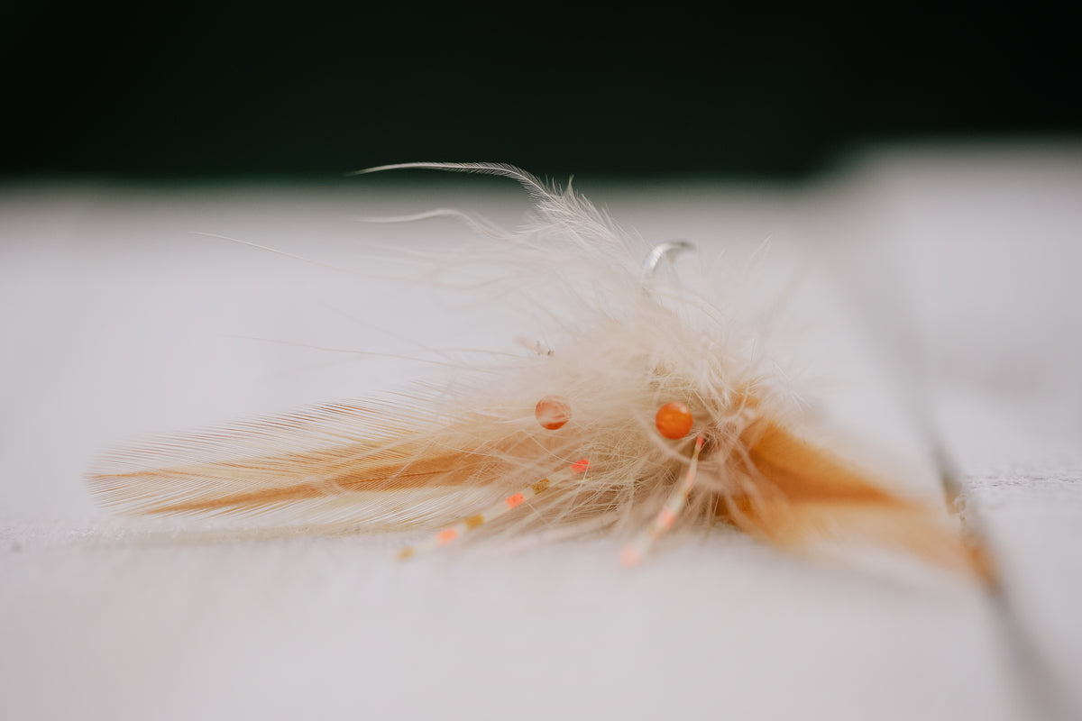 closeup details of the Tarpon Crab tarpon fly in tan colorway tied by Josh Idol of Two Aught Fly Fishing Co