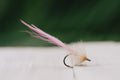 a closeup shot of the Worm tarpon fly in pink and tan colorway